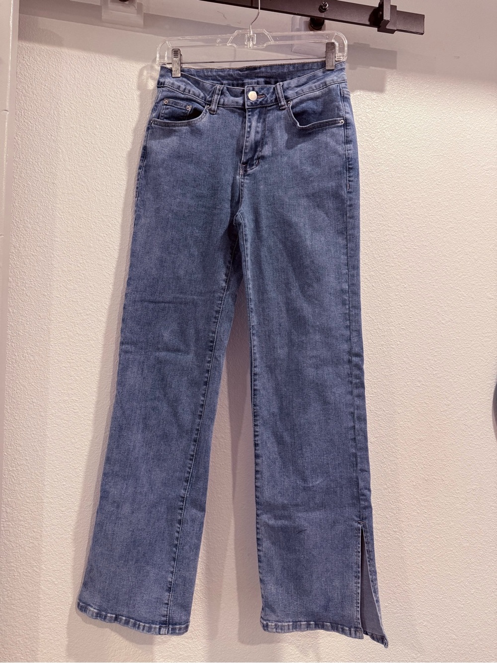 Women's Mid Wash Blue Flare Jeans with Side Slit. Comfy casual fit!